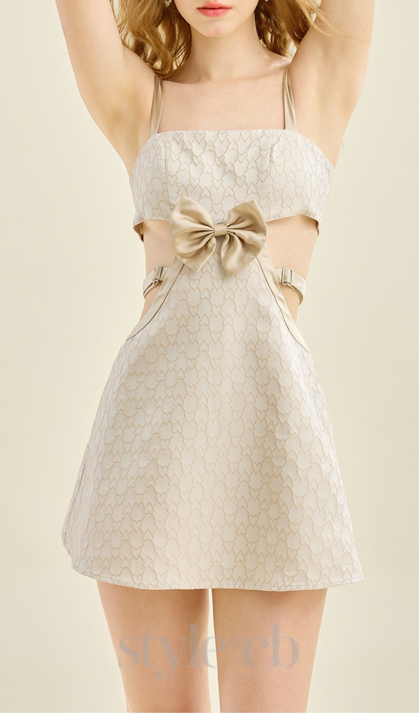 BOW EMBELLISHED CUTOUT MINI DRESS IN APRICOT