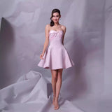 BOW STRAPLESS MINI DRESS IN PINK