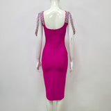 CRYSTAL BANDAGE MIDI DRESS IN HOT PINK